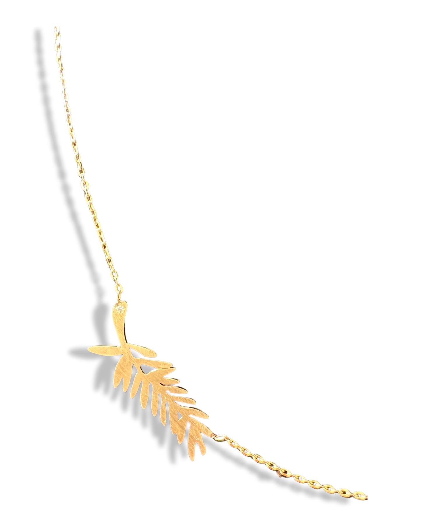 Attached Palme d’or necklace with a diamond