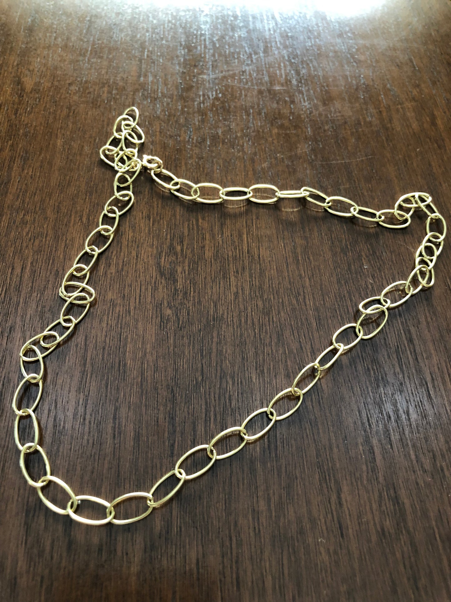 Adjustable chain with big rings in yellow gold