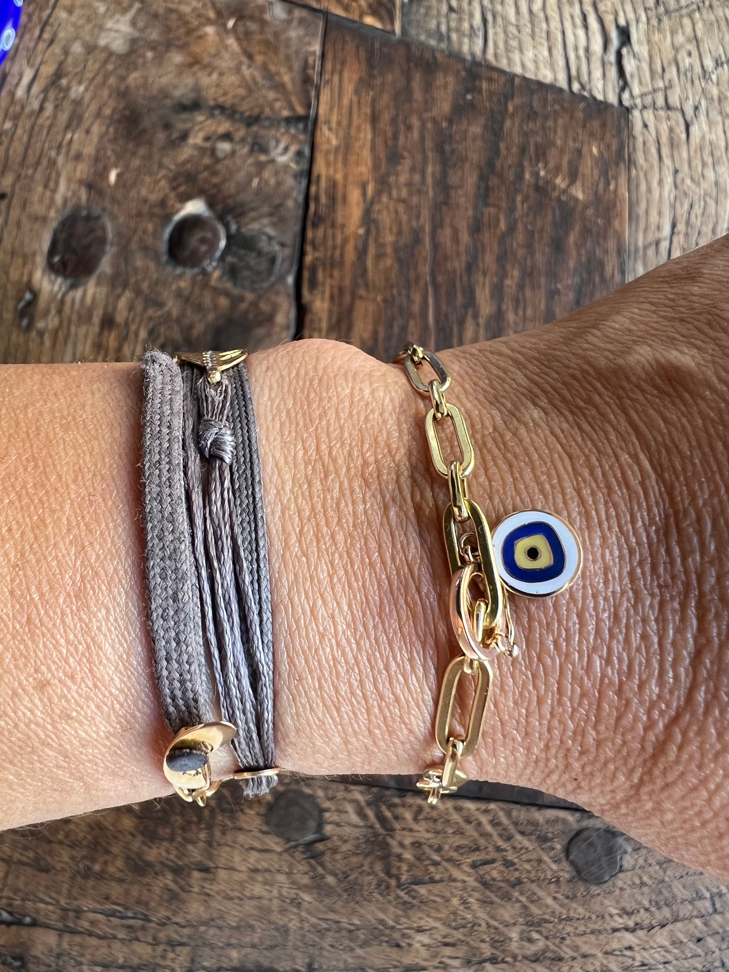 Greek evil eye charm in pink gold and blue enamel