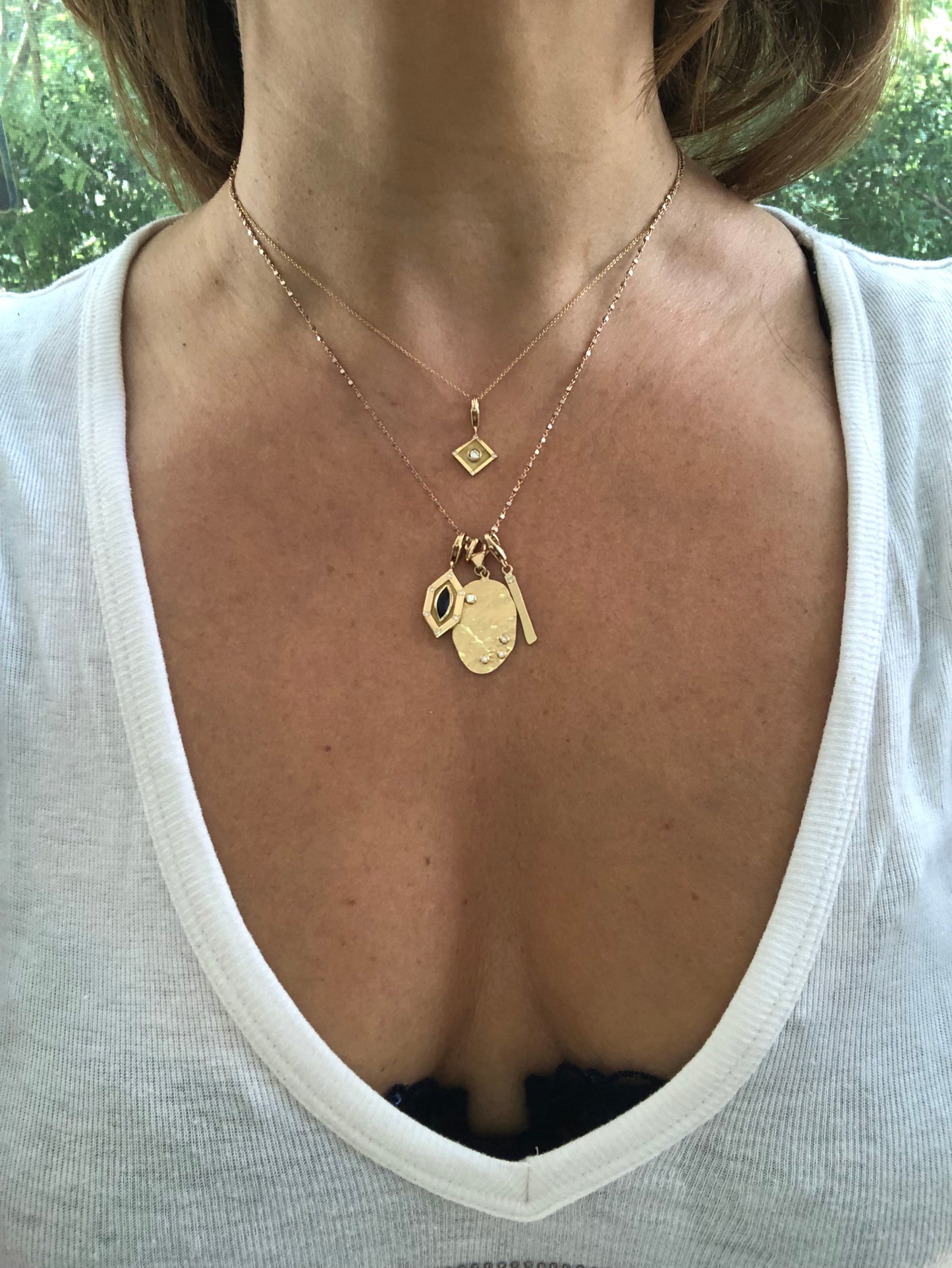 Organic shaped hand hammered large charm with diamonds in yellow gold