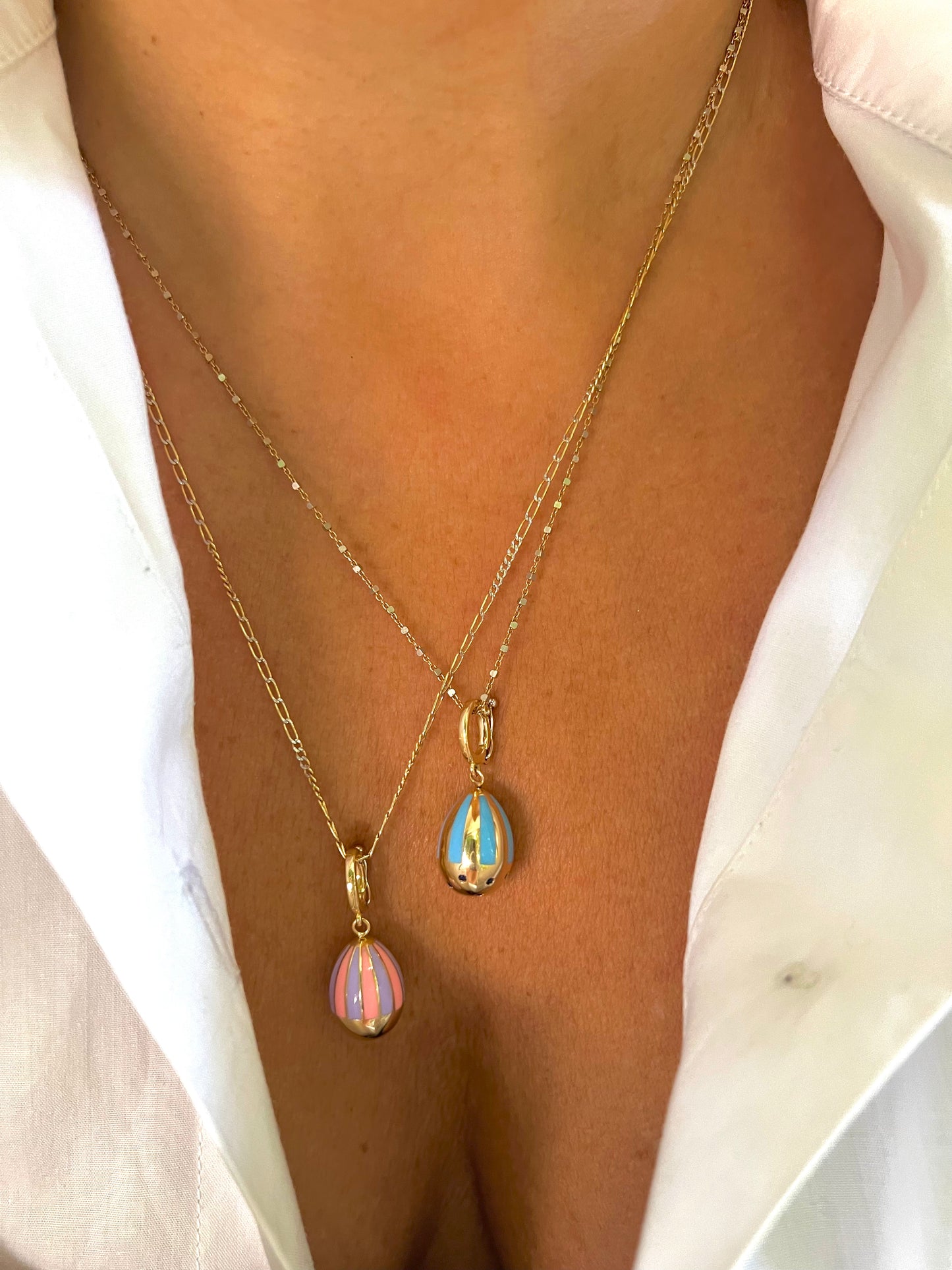 Enamelled baby blue and gold Egg Charm polished finish with blue sapphire