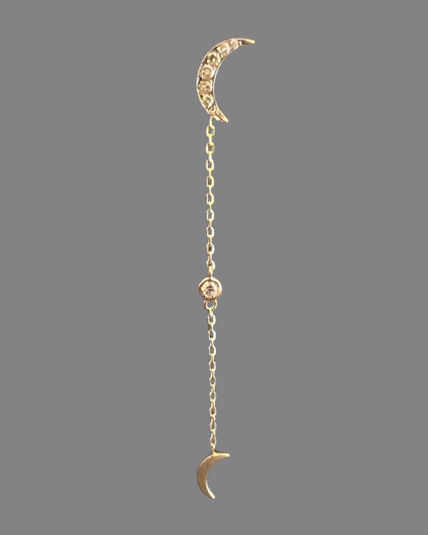 Black rhodium double crescent moon earring with a diamond drop in yellow gold
