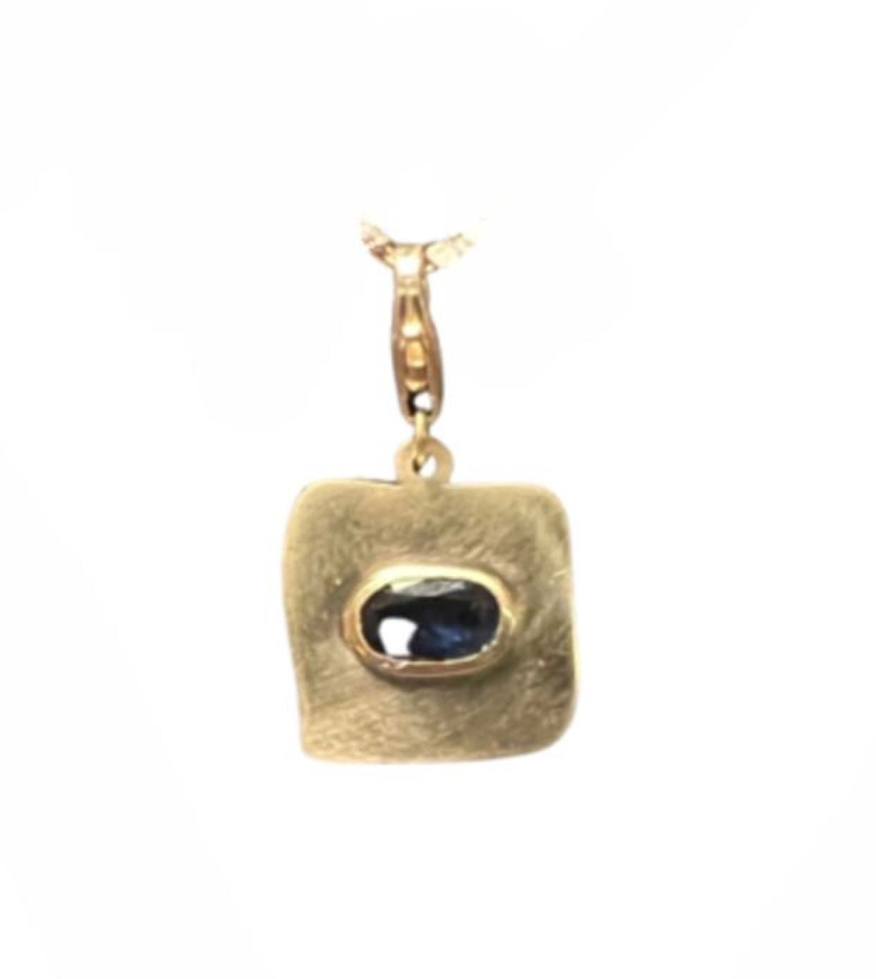 Semi matte finish square charm with a blue sapphire in yellow gold