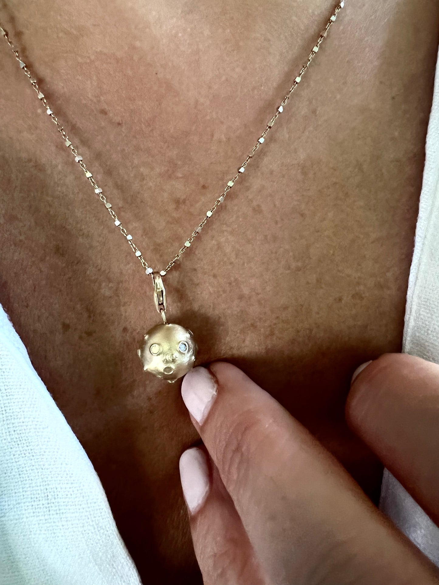 Full Moon lucky charm with diamonds in yellow gold, matte finish