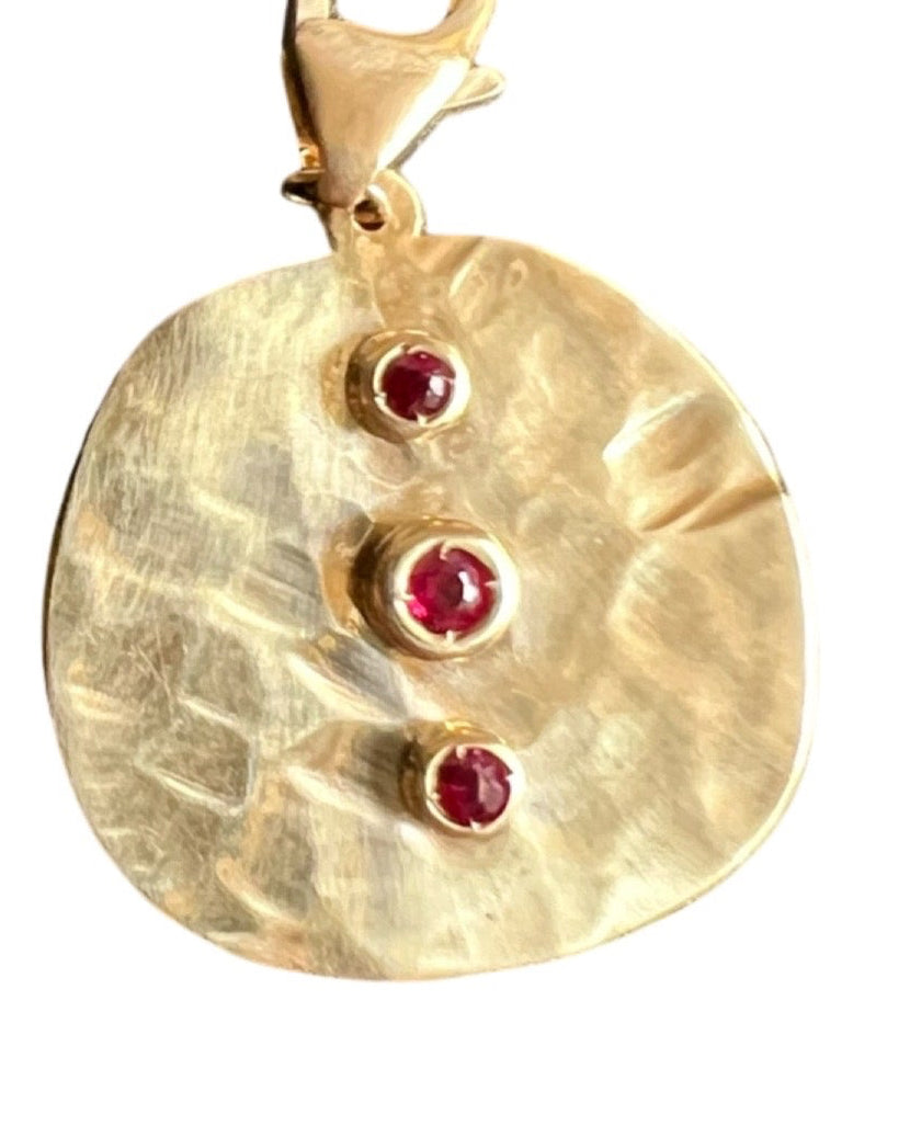 Coin charm with rubies