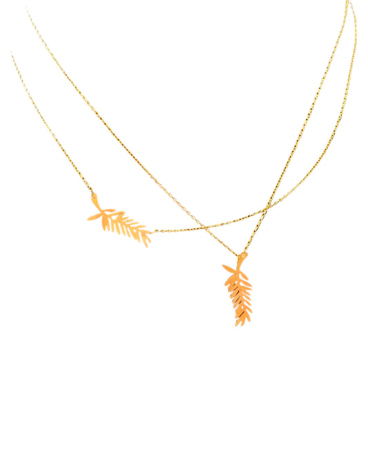 Attached Palme d’or necklace with a diamond