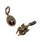 Lucky beginning egg charm with black and white diamonds in pink solid gold