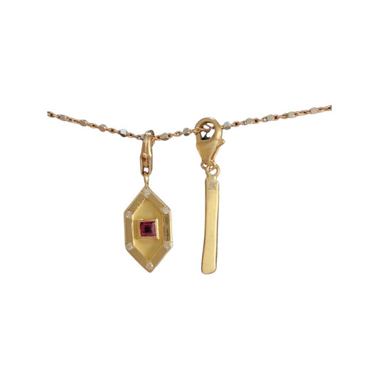 Art Deco charm with princess cut ruby and diamonds in yellow gold