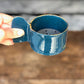 Petrol blue burner with Gold rim and elliptical handle