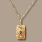 Hammered big page charm with blue sapphires in yellow gold