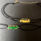 Enamel mini dark green Bus bracelet with a black cord and yellow gold