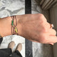 Enamel mini yellow Bus bracelet with a black cord and yellow gold
